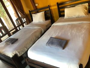 Postel nebo postele na pokoji v ubytování Pai resort pageryaw