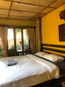 Postel nebo postele na pokoji v ubytování Pai resort pageryaw