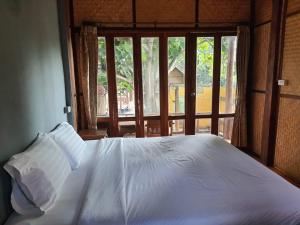 Postel nebo postele na pokoji v ubytování Pai resort pageryaw