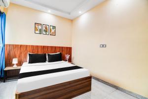 Postelja oz. postelje v sobi nastanitve Super Hotel O DumDum Thana More formerly Bimla Regency
