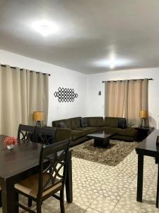 a living room with a couch and a table at Casa Marina Miramar in Ciudad Madero