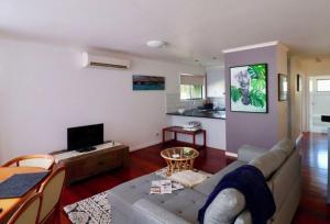 a living room with a couch and a table at 5 36 Maurice Avenue in Mallacoota