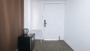 Fotografie z fotogalerie ubytování RedDoorz Premium at THE GRAND PENINSULA SUITES v destinaci Balanga