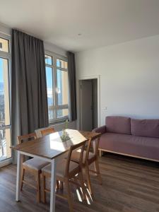 a living room with a table and a couch at Urlaubshaus-Erzgebirge in Zwönitz