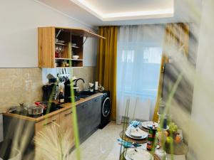 a kitchen with a sink and a counter top at Modernes LuxusApartment in Essen in Essen