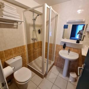 Łazienka w obiekcie Le Grand Hotel