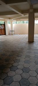 a empty room with a bench in a building at Lola Homes Thika in Thika