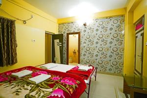 Postel nebo postele na pokoji v ubytování Hotel Prashant Near Jahaz Bari New Digha