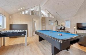 a living room with a pool table in it at Beautiful Home In Otterup With Sauna in Otterup