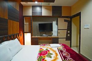 Postel nebo postele na pokoji v ubytování Hotel Prashant Near Jahaz Bari New Digha