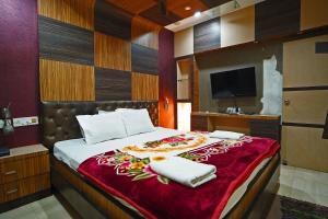 Postel nebo postele na pokoji v ubytování Hotel Prashant Near Jahaz Bari New Digha