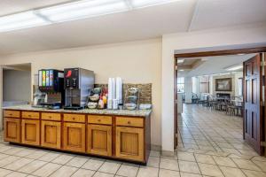 a kitchen with a counter with a coffee maker on it at Quality Inn & Suites at Dollywood Lane in Pigeon Forge