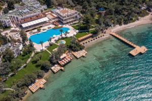 an aerial view of a resort on the water at DoubleTree by Hilton Bodrum Isil Club Ultra All-Inclusive Resort in Torba