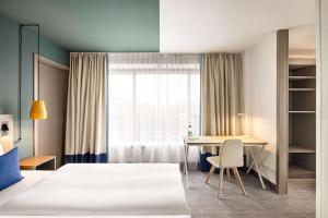 Ein Bett oder Betten in einem Zimmer der Unterkunft Vienna House Easy by Wyndham Berlin Prenzlauer Berg