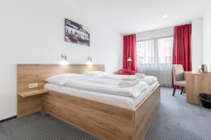 Posteľ alebo postele v izbe v ubytovaní Sport HOTEL Centrum
