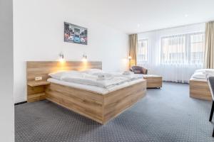 Posteľ alebo postele v izbe v ubytovaní Sport HOTEL Centrum