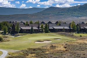 a view of the golf course at a resort at 19th Hole cabin in Granby +36 photos
