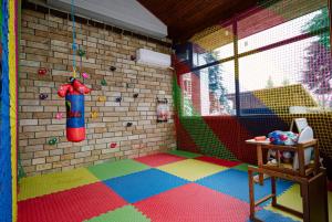a room with a play room with a wall at The Lodge Hotel in Borovets
