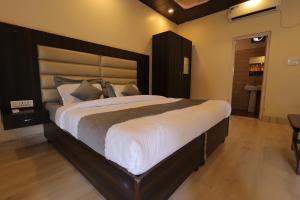 Photo de la galerie de l'établissement The Palms Resort By Crystona Hotels & Resorts, à Rāiwāla 8 autres photos