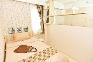 Ένα ή περισσότερα κρεβάτια σε δωμάτιο στο Annora Living by RDK