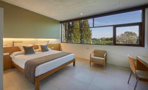 Postel nebo postele na pokoji v ubytování URH - Hotel Molí del Mig + 35 fotografií
