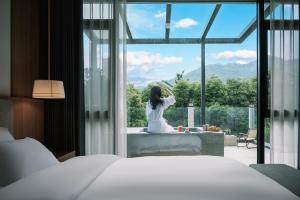Postel nebo postele na pokoji v ubytování Z HOTEL- Qingchengshan
