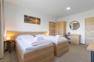 Posteľ alebo postele v izbe v ubytovaní Sport HOTEL Bečva