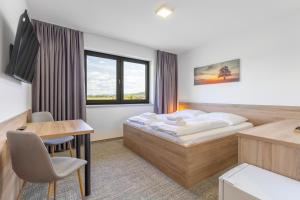 Posteľ alebo postele v izbe v ubytovaní Sport HOTEL Bečva