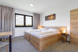 Posteľ alebo postele v izbe v ubytovaní Sport HOTEL Bečva