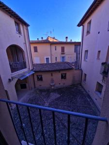 a view of two buildings from the top of a staircase at ArcoArilaci in Rieti