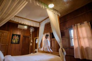 Postel nebo postele na pokoji v ubytování Herntai Resort Maelanoi
