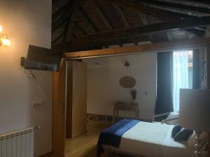 Postel nebo postele na pokoji v ubytování Casa Grande de Cristosende