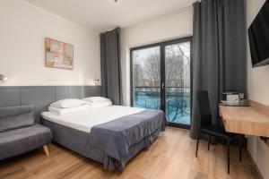 Postel nebo postele na pokoji v ubytování Hotell Tammsaare + 23 fotografií
