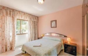 Ένα ή περισσότερα κρεβάτια σε δωμάτιο στο 3 Bedroom Lovely Apartment In Malaga
