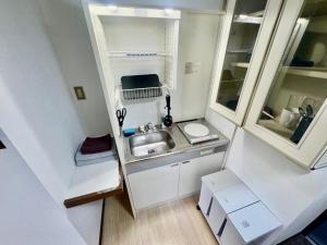 Kuchyň nebo kuchyňský kout v ubytování Apartment Hotel Kuki