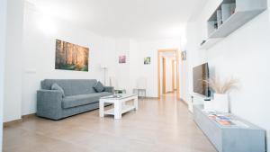 a living room with a couch and a table at Cuchillos de la fonseca in Casas de Moya