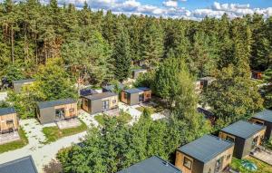 an aerial view of a home in the woods at Tiny Haus im Waldcamping am Brombachsee in Pleinfeld