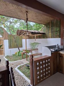 an outdoor kitchen with a table and a sink at Secret spot 3 in El Nido +14 photos