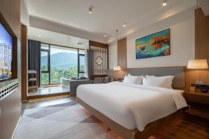Postel nebo postele na pokoji v ubytování Z HOTEL- Qingchengshan