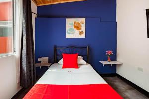 Postel nebo postele na pokoji v ubytování Hotel Casa Normandia