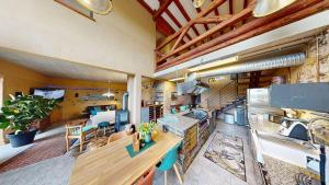 a large room with a kitchen and a living room at Ferienhaus Maifelder Wellness Loft In Gappenach in Gappenach