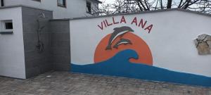 a building with a sign on the side of it at Villa Ana in Kaštel +23 photos