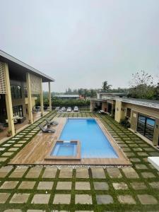 a swimming pool in the middle of a building at Cristina's Holiday Home in Tagaytay