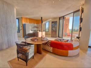 a living room with a couch and a table at The Ekipa in Okaukuejo