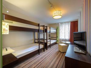 Postel nebo postele na pokoji v ubytování Mövenpick Hotel Egerkingen + 37 fotografií