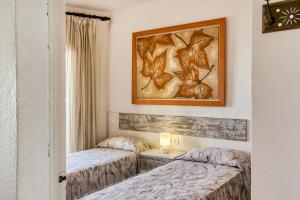 A bed or beds in a room at Apt Sol y Mar 2 dorm Playa Riells