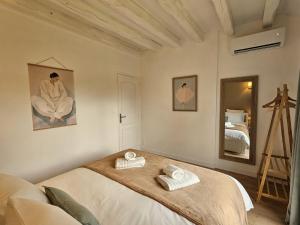 Postel nebo postele na pokoji v ubytování Gîte du Magnolia