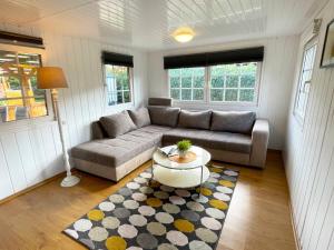a living room with a couch and a table at Ferienhaus Jonny in Sassenberg