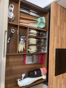 a drawer filled with lots of utensils at Cassandre in Montoire-sur-le-Loir +68 photos