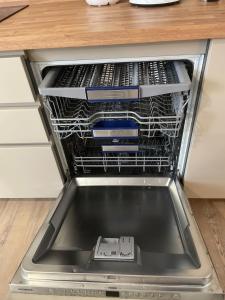 a dishwasher filled with dishes and other appliances at Cassandre in Montoire-sur-le-Loir